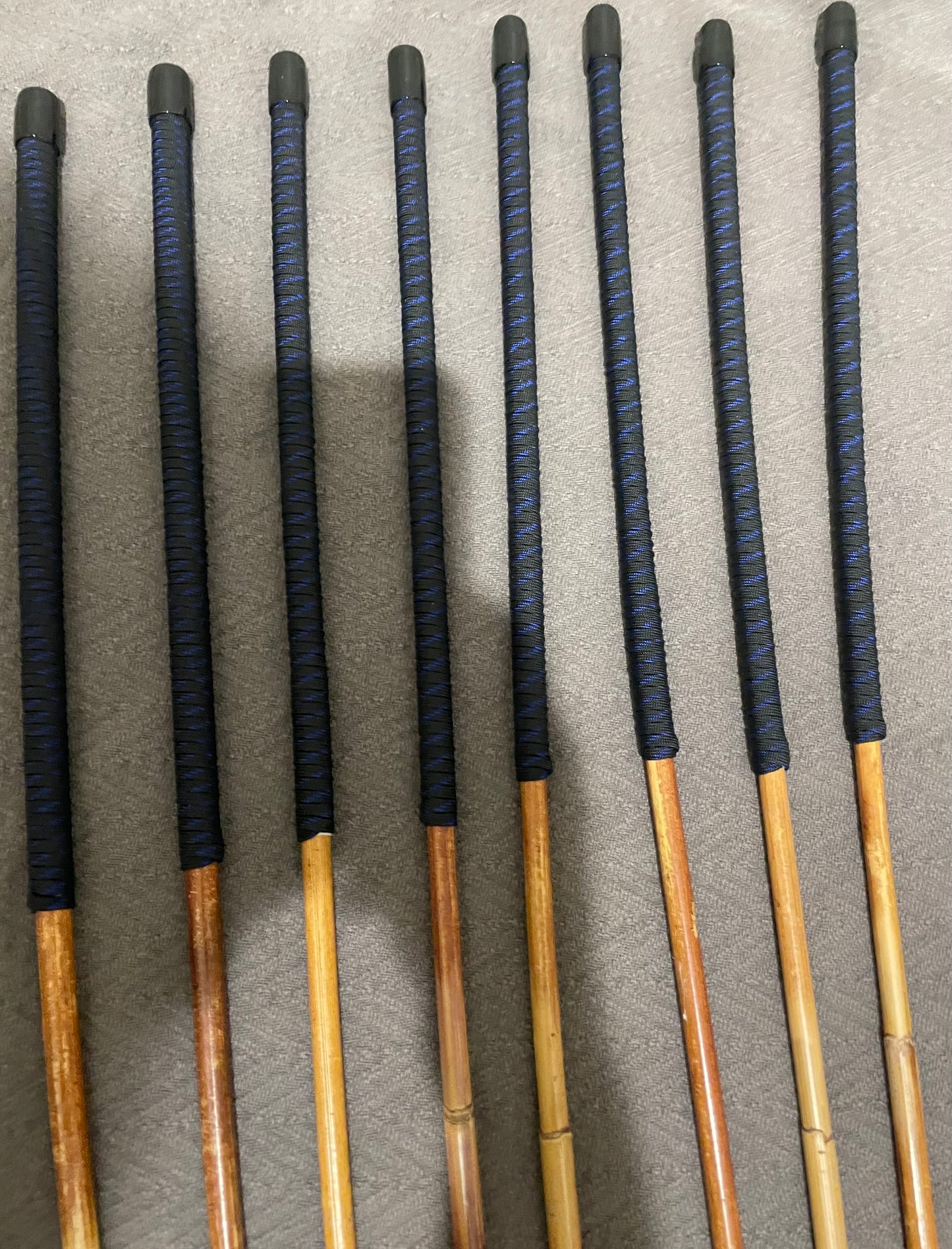 Set of 8 Dragon Rattan Punishment Canes / BDSM Canes with Blue Streak Paracord Handles - SALES SPECIAL - 90 cms Length - Englishvice Canes