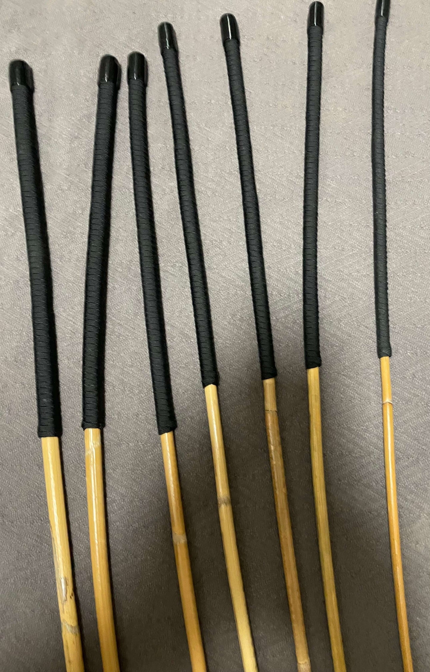 Set of 7 Kooboo Rattan Punishment canes / School Canes / BDSM Canes with Black Paracord Handles -- 72 to 87 cms Length - Englishvice Canes