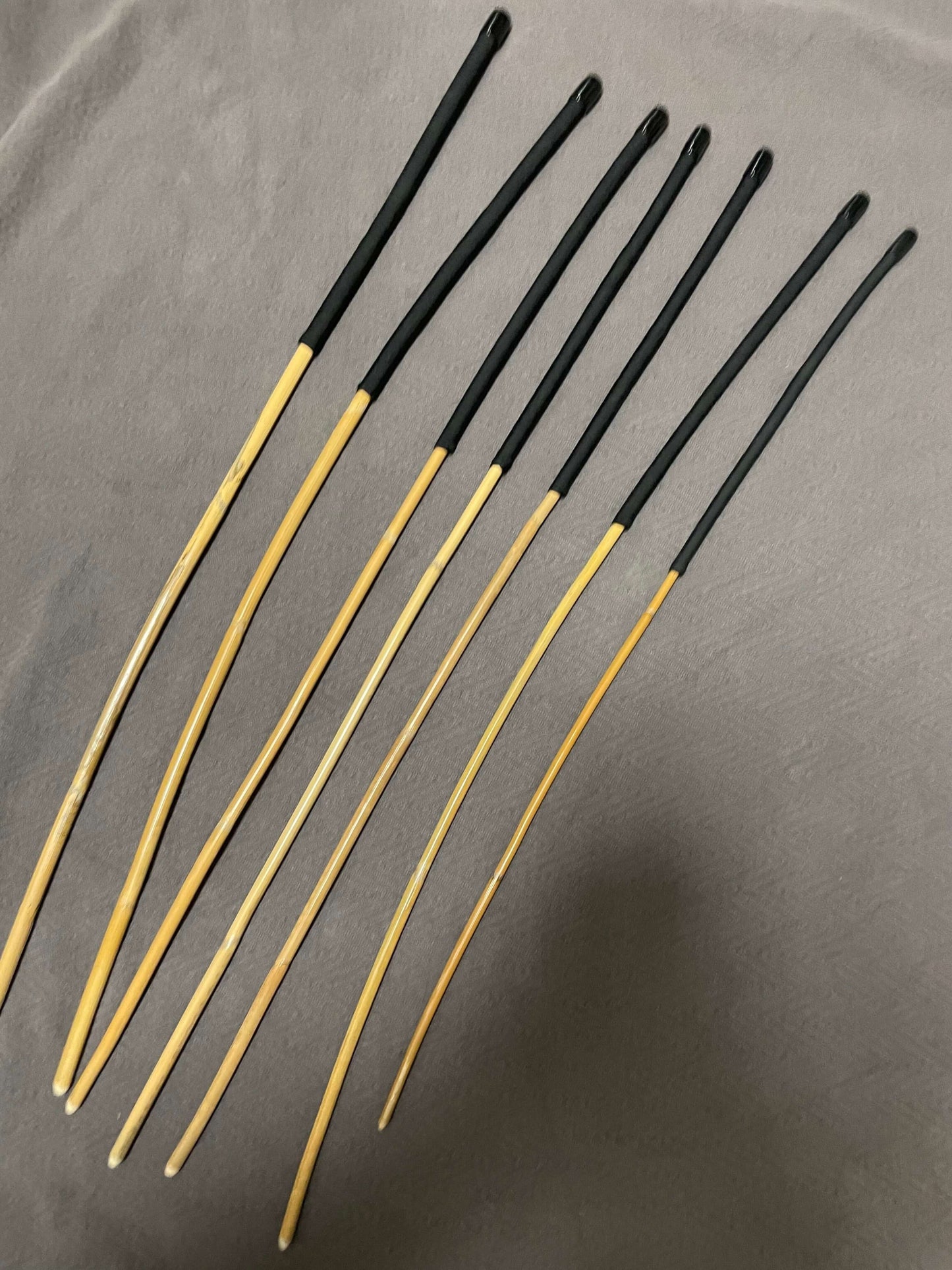 Set of 7 Kooboo Rattan Punishment canes / School Canes / BDSM Canes with Black Paracord Handles -- 72 to 87 cms Length - Englishvice Canes
