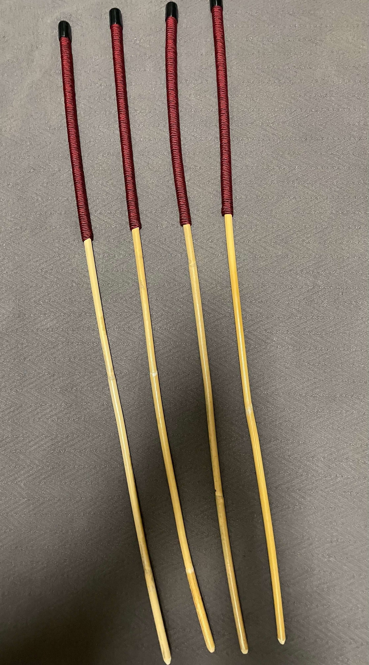 Set of 4 Classic Kooboo Rattan Punishment canes with Liquorice Paracord Handles - 85 to 88 cms Length - 9.5 to 10.5 mm Diameters - Englishvice Canes