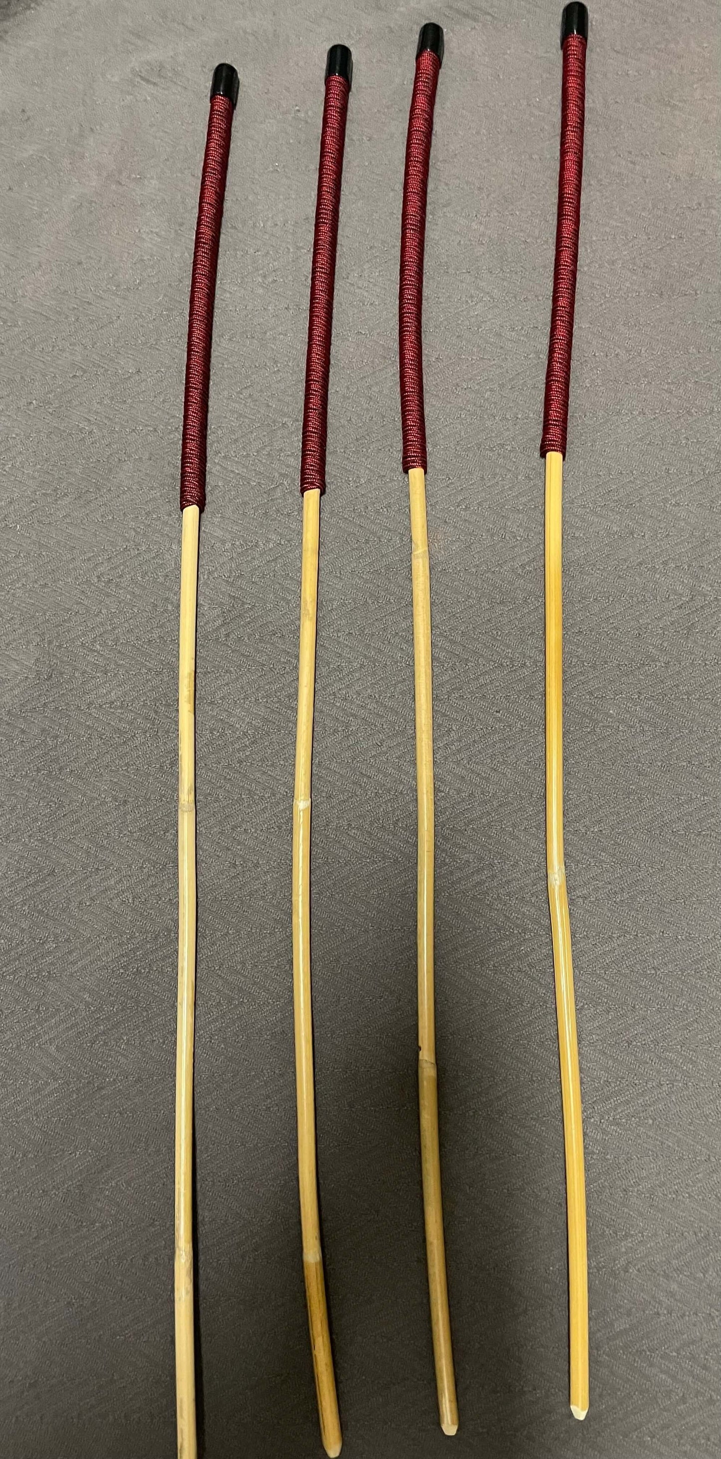 Set of 4 Classic Kooboo Rattan Punishment canes with Liquorice Paracord Handles - 85 to 88 cms Length - 9.5 to 10.5 mm Diameters - Englishvice Canes
