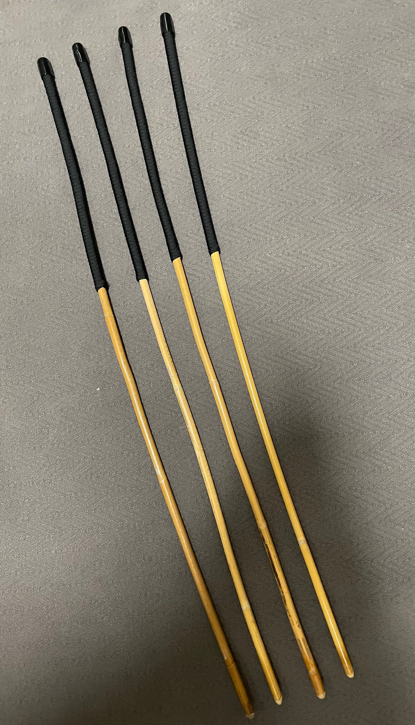 Set of 4 Senior Kooboo Rattan Punishment canes with Black Paracord Handles - 83 to 87 cms L & 9.5 - 10.5 mm D - Englishvice Canes