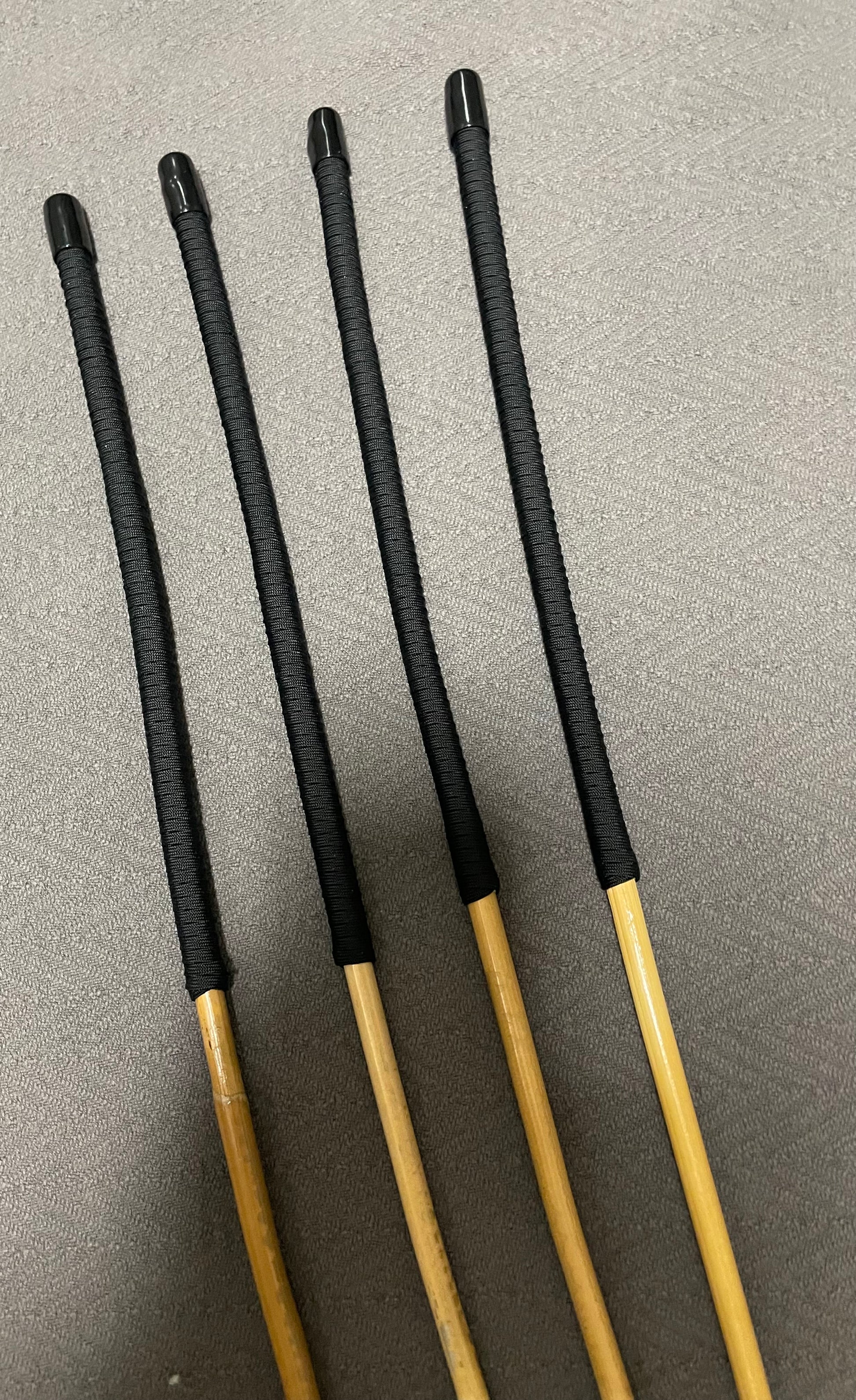 Set of 4 Senior Kooboo Rattan Punishment canes  with Black Paracord Handles - 83 to 87 cms L & 9.5 - 10.5 mm D - Englishvice Canes