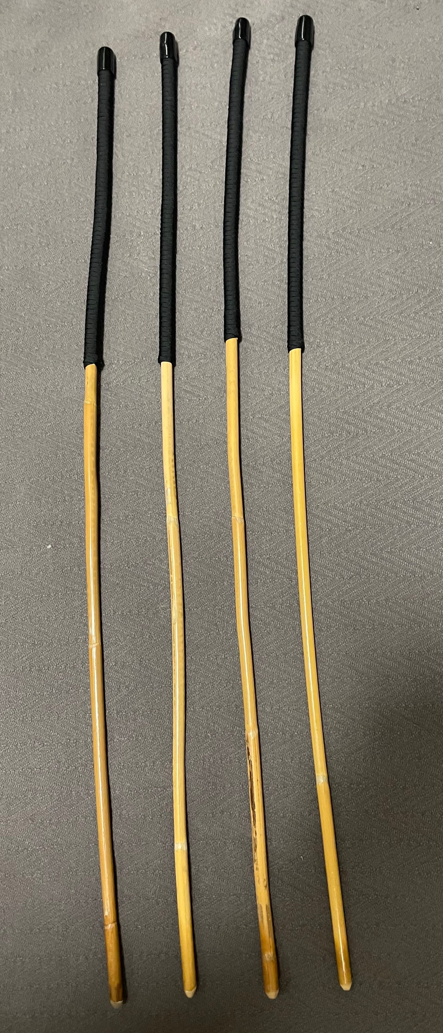 Set of 4 Senior Kooboo Rattan Punishment canes with Black Paracord Handles - 83 to 87 cms L & 9.5 - 10.5 mm D - Englishvice Canes