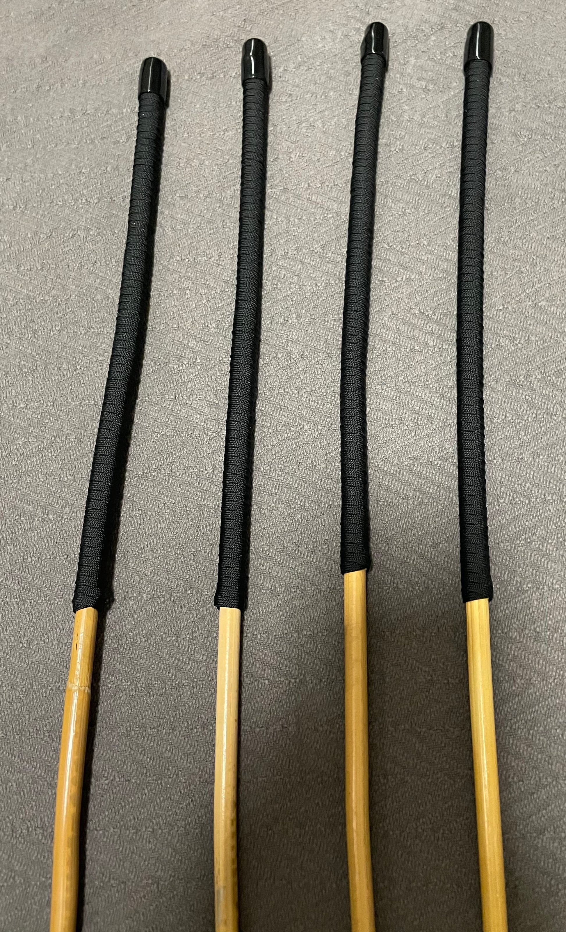 Set of 4 Senior Kooboo Rattan Punishment canes  with Black Paracord Handles - 83 to 87 cms L & 9.5 - 10.5 mm D - Englishvice Canes