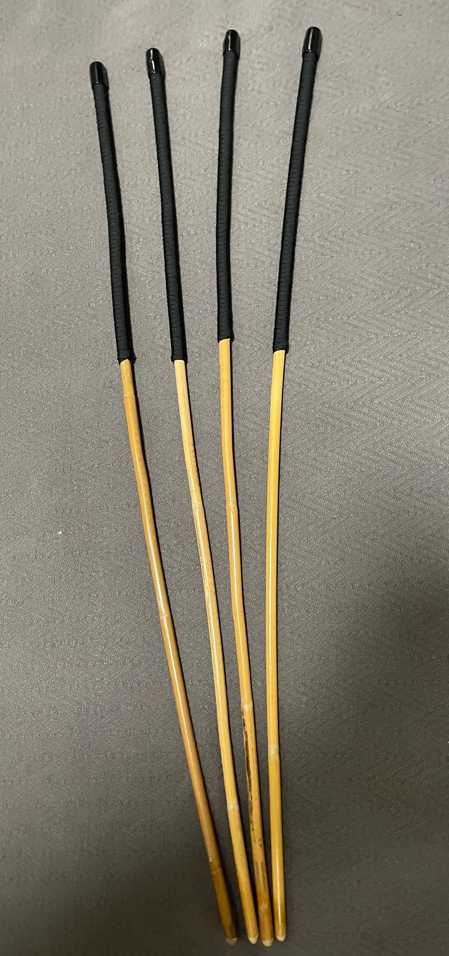 Set of 4 Senior Kooboo Rattan Punishment canes with Black Paracord Handles - 83 to 87 cms L & 9.5 - 10.5 mm D - Englishvice Canes