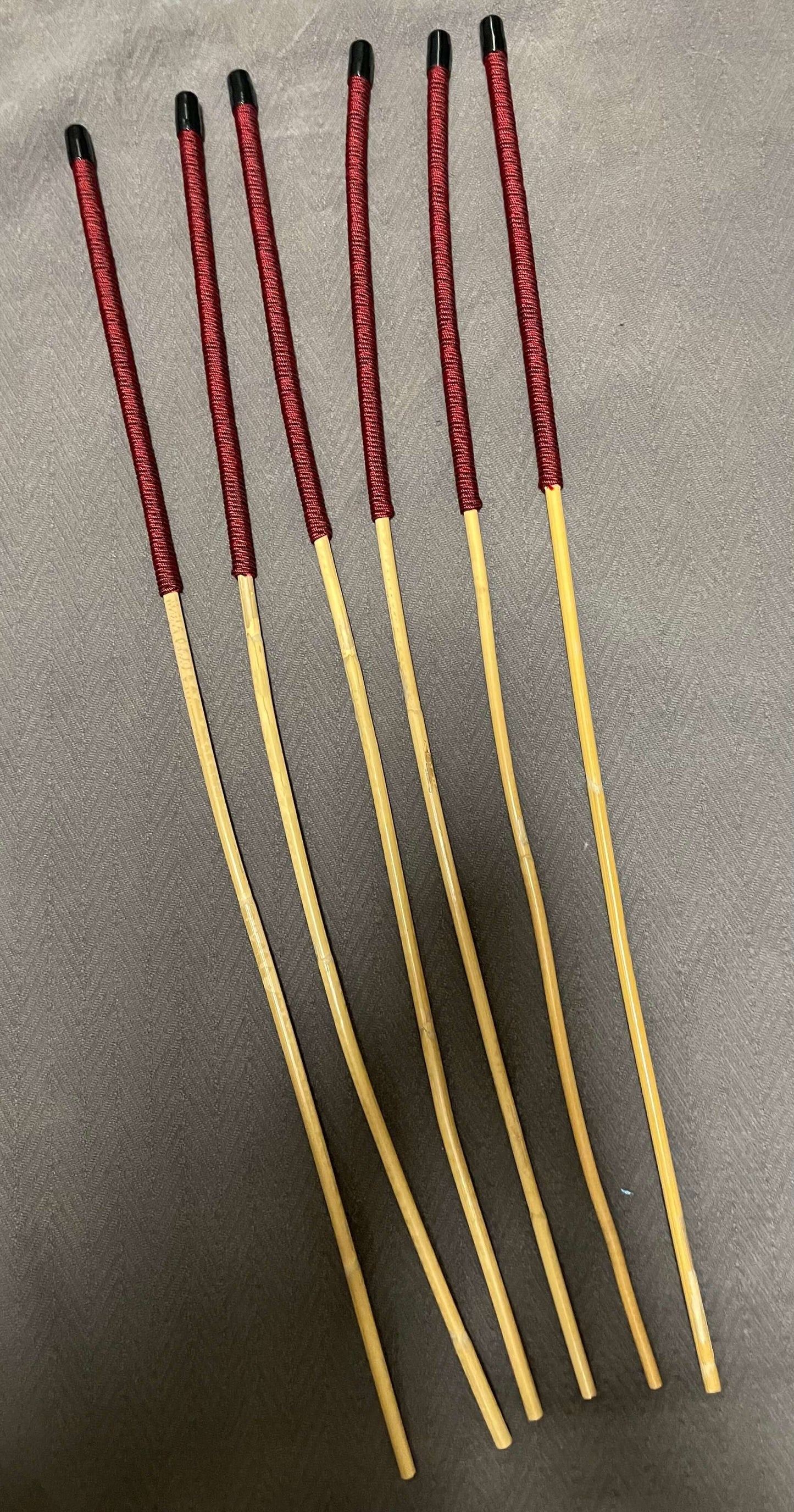 Set of 6 Classic Kooboo Rattan Punishment canes with Liquorice Paracord Handles - 82 to 85 cms Length - 8 to 9.5 mm Diameters - Englishvice Canes