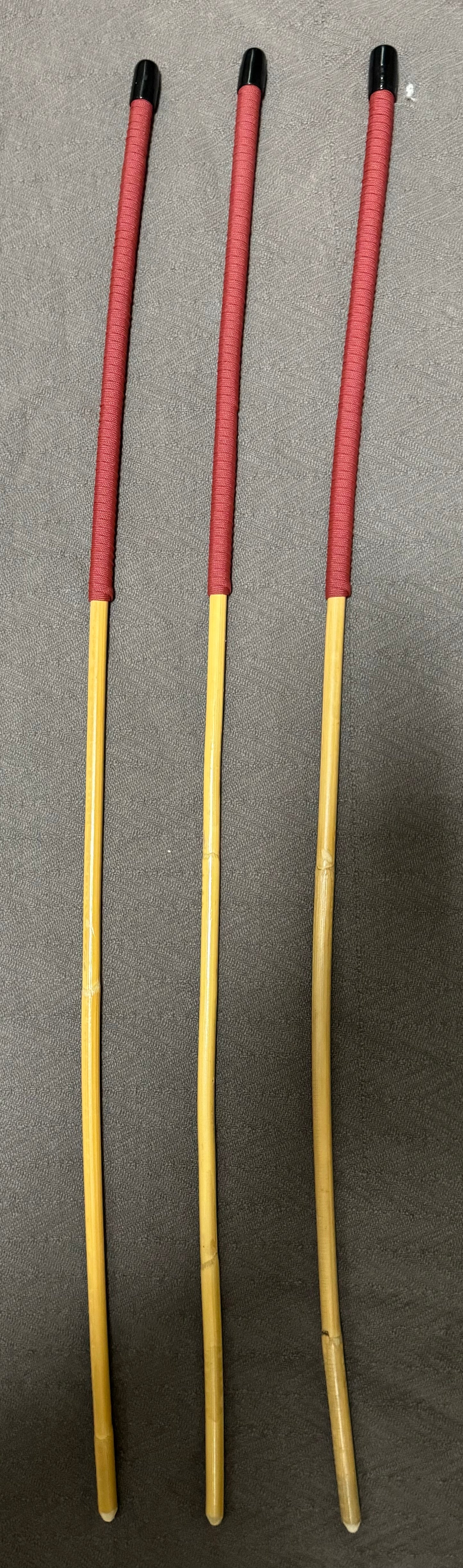 Set of 3 Classic Kooboo Rattan Punishment canes with BRICK RED Paracord Handles - 82 to 84 cms L - 9 - 10 mm D - Englishvice Canes