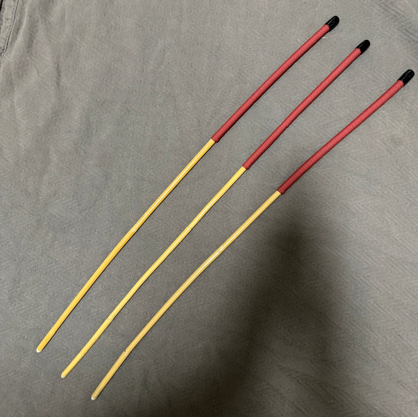 Set of 3 Classic Kooboo Rattan Punishment canes with BRICK RED Paracord Handles - 82 to 84 cms L - 9 - 10 mm D - Englishvice Canes