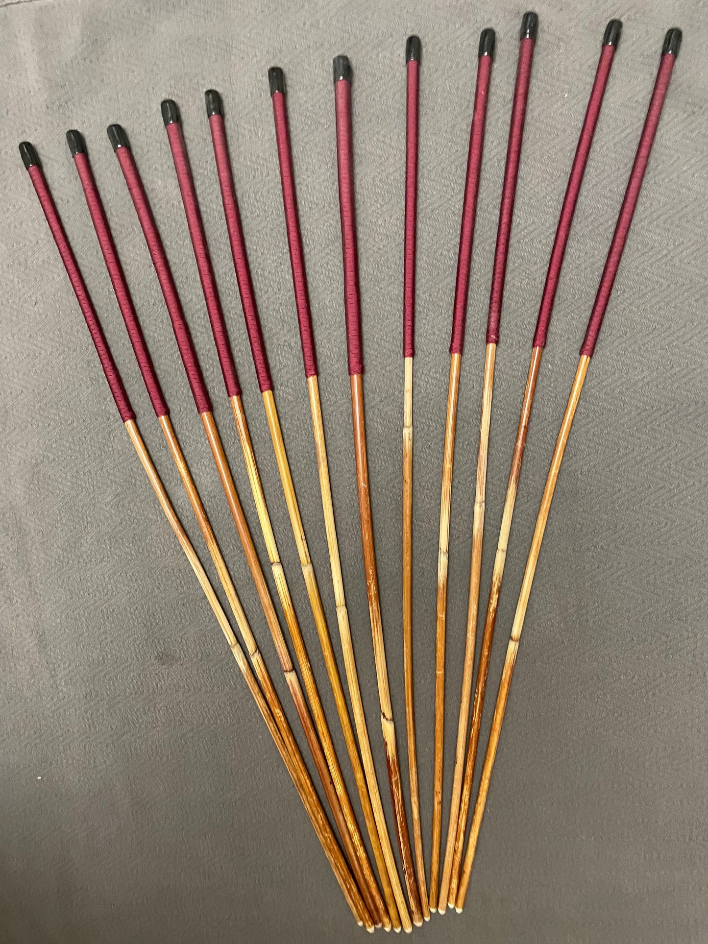 Set of 12 Classic Dragon Rattan Punishment Canes with Burgundy Paracord Handles - 95 to 100 cms Length - Sales Special