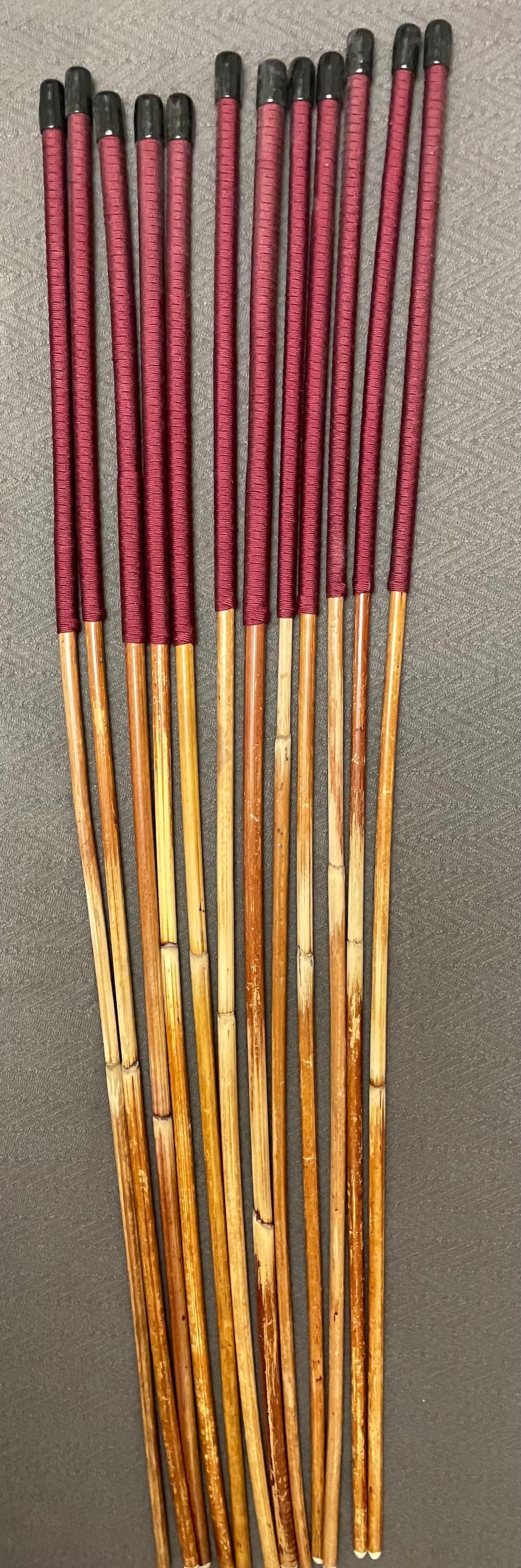 Set of 12 Classic Dragon Rattan Punishment Canes with Burgundy Paracord Handles - 95 to 100 cms Length - Sales Special