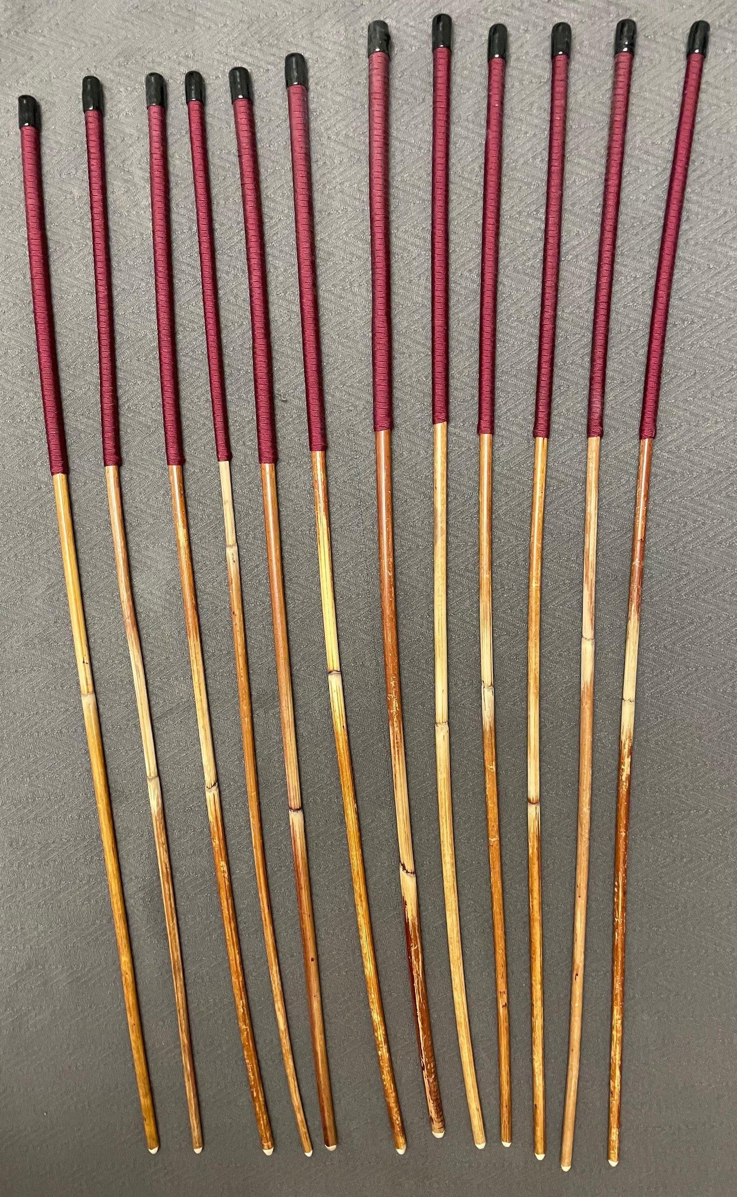 Set of 12 Classic Dragon Rattan Punishment Canes with Burgundy Paracord Handles - 95 to 100 cms Length - Sales Special