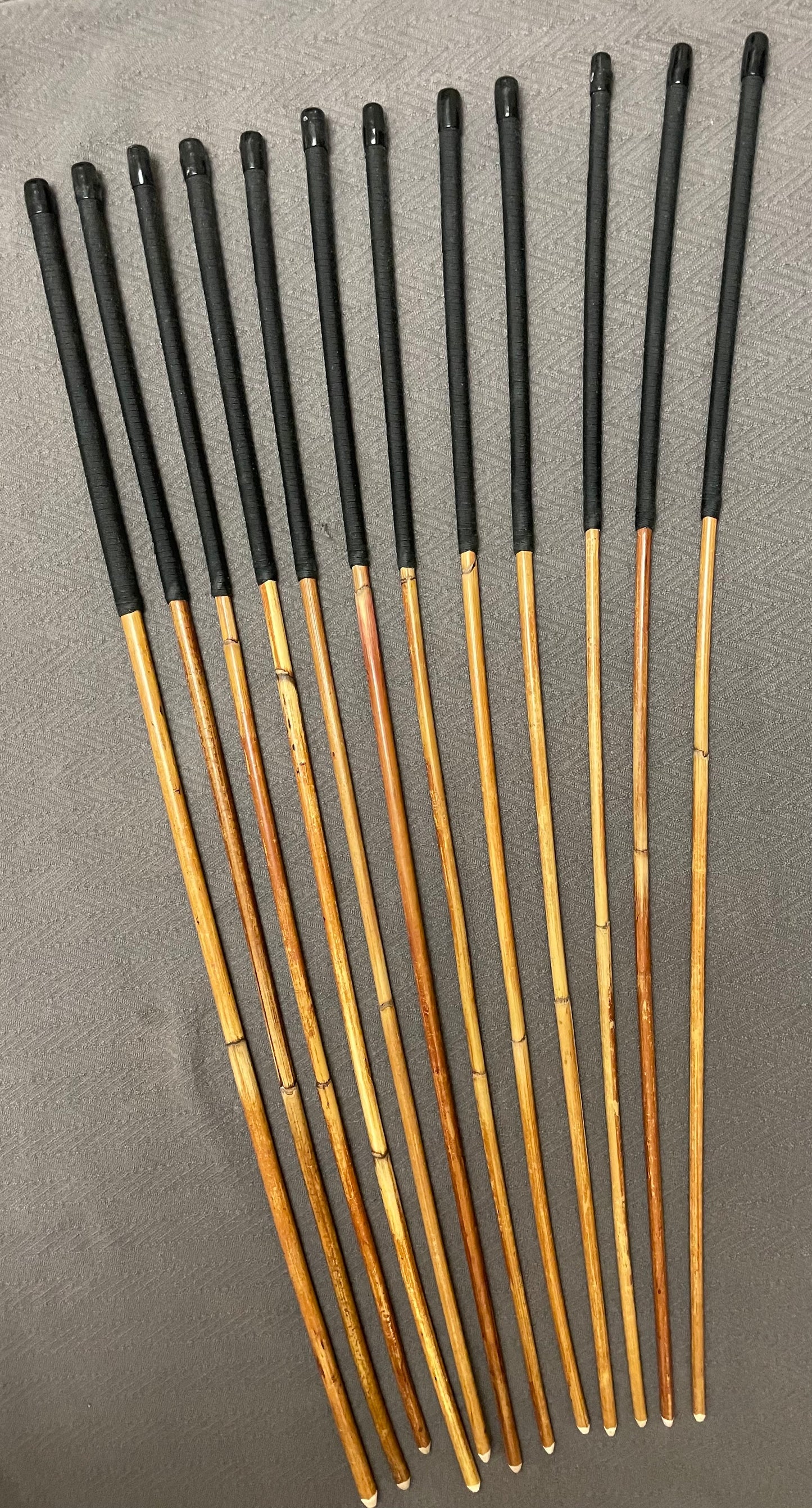 Set of 12 Classic Dragon Rattan Punishment Canes with Black Paracord Handles - 95 to 100 cms Length - Sales Special