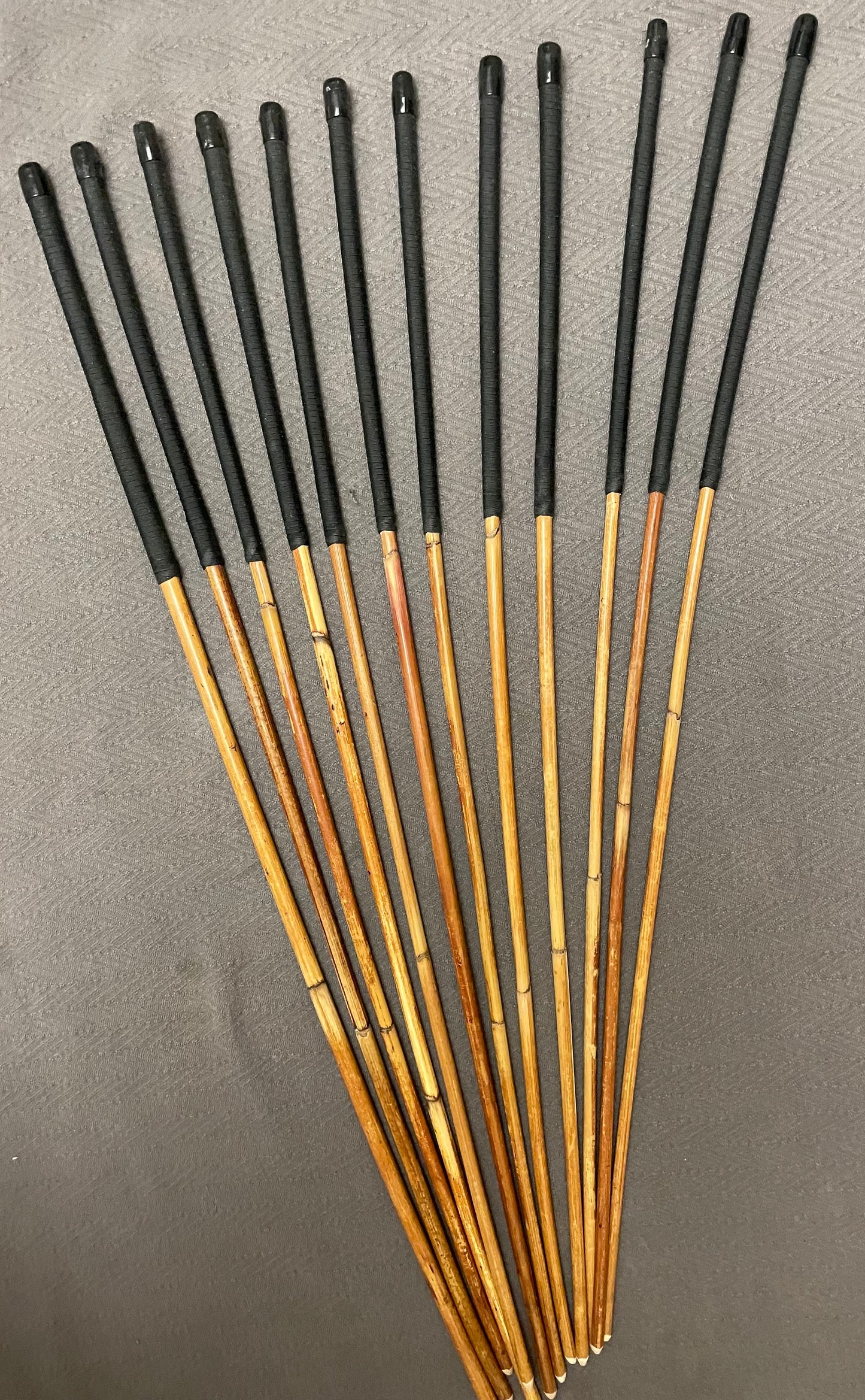 Set of 12 Classic Dragon Rattan Punishment Canes with Black Paracord Handles - 95 to 100 cms Length - Sales Special
