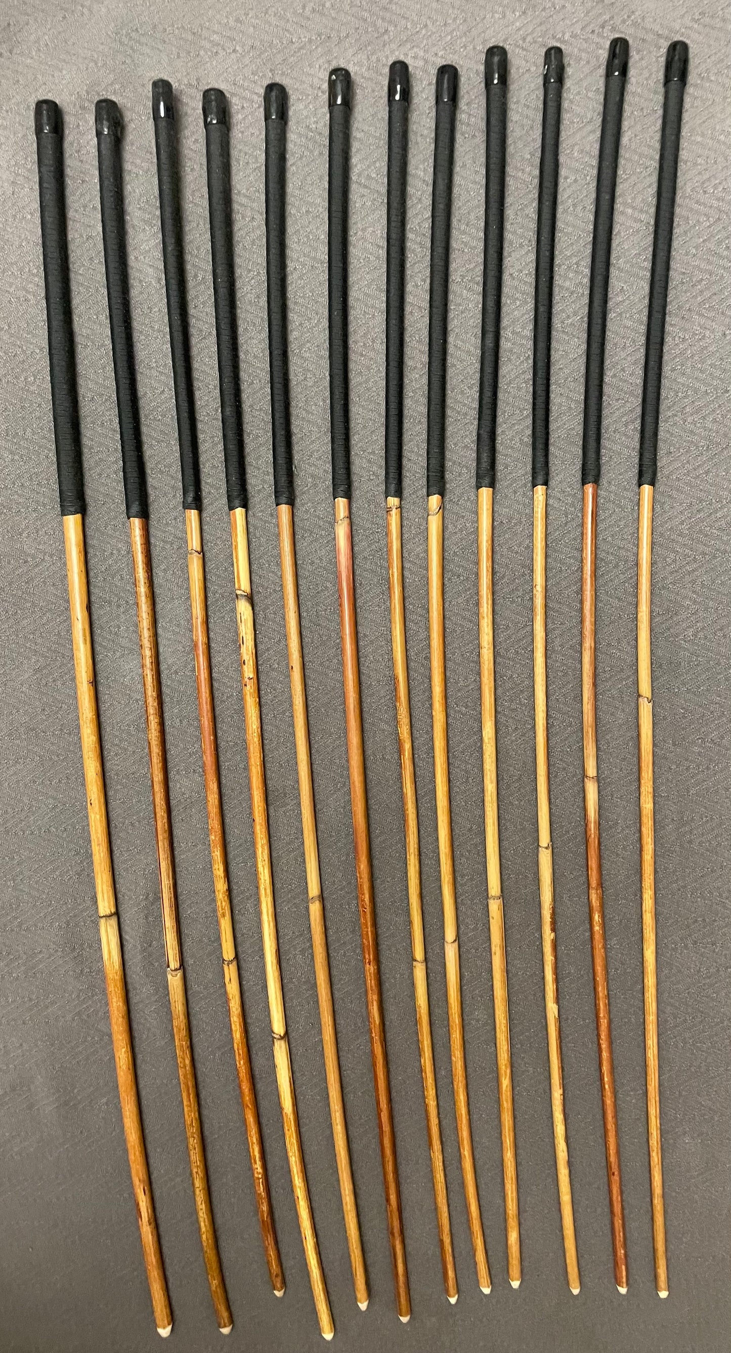Set of 12 Classic Dragon Rattan Punishment Canes with Black Paracord Handles - 95 to 100 cms Length - Sales Special