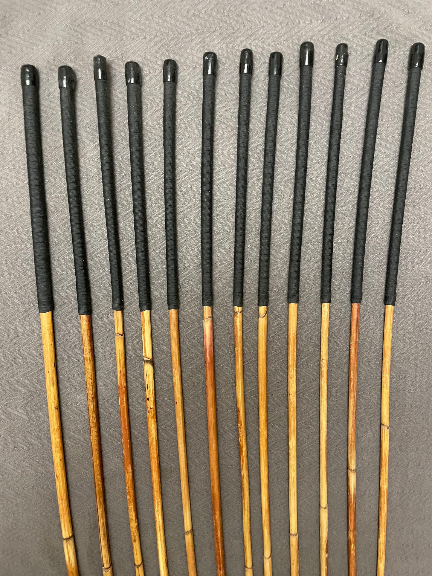 Set of 12 Classic Dragon Rattan Punishment Canes with Black Paracord Handles - 95 to 100 cms Length - Sales Special