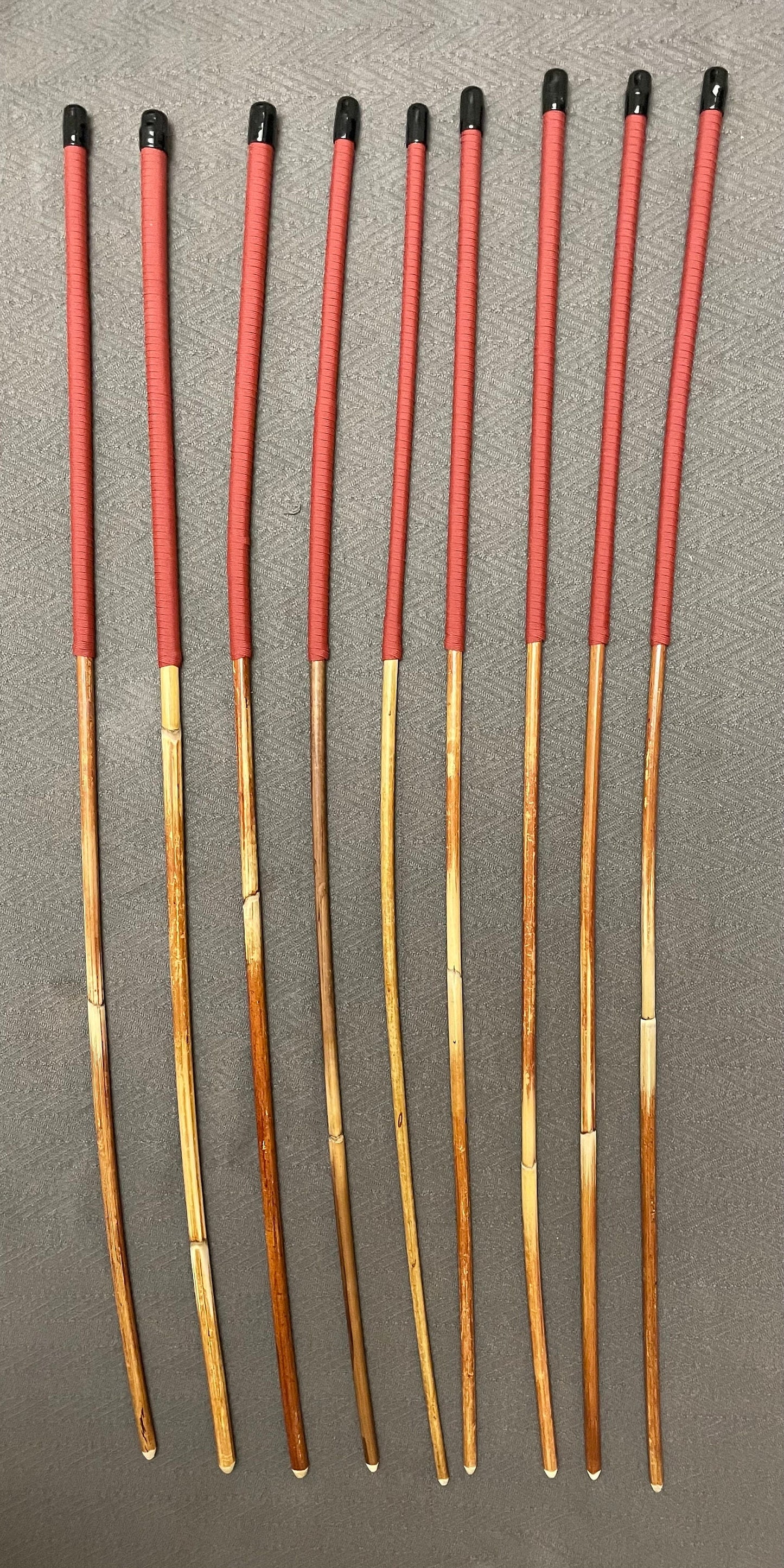 Set of 9 Classic Dragon Rattan Punishment Canes / BDSM Canes with Brick Red Paracord Handles - 95 cms Length - Englishvice Canes