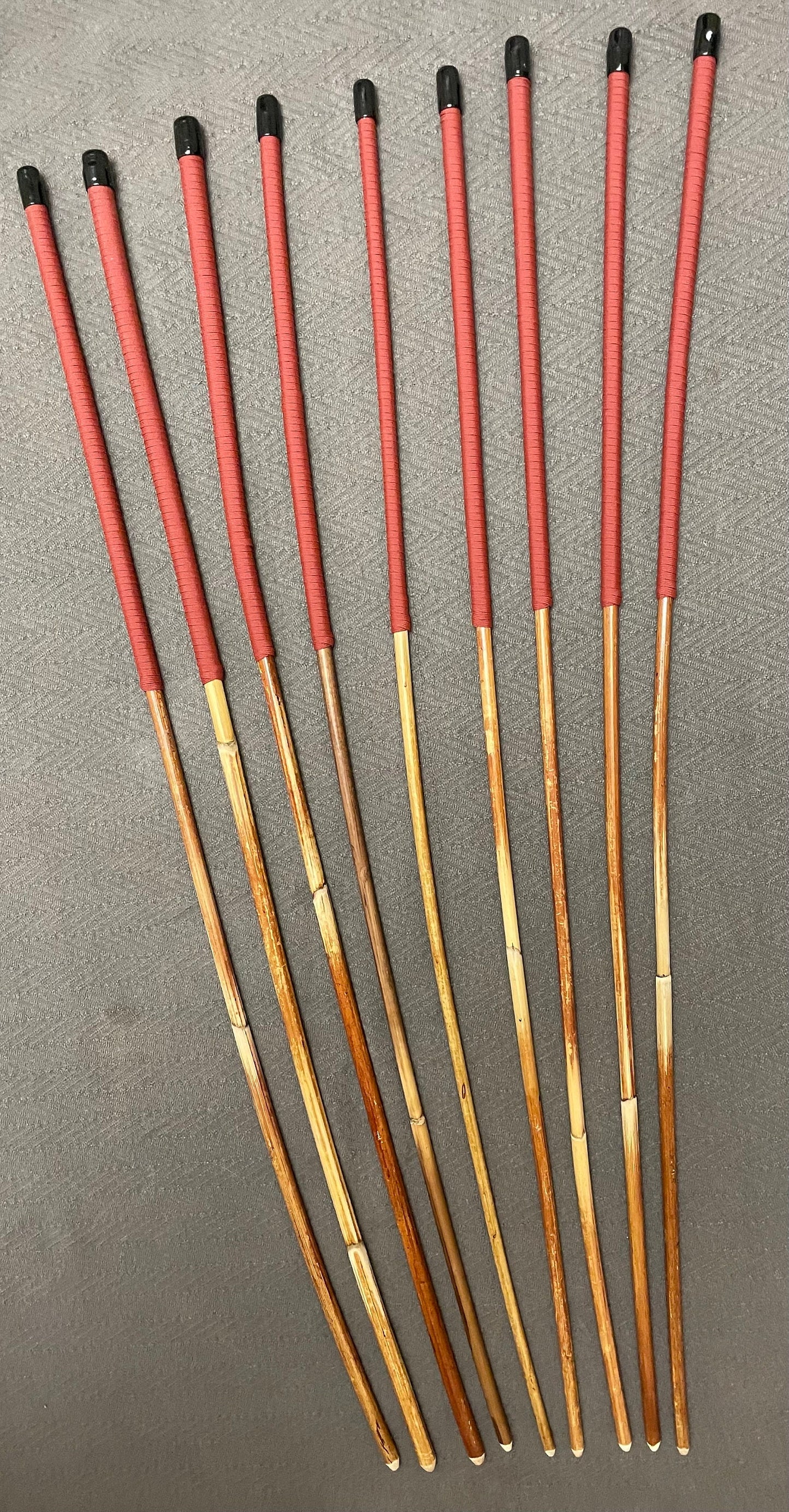 Set of 9 Classic Dragon Rattan Punishment Canes / BDSM Canes with Brick Red Paracord Handles - 95 cms Length - Englishvice Canes