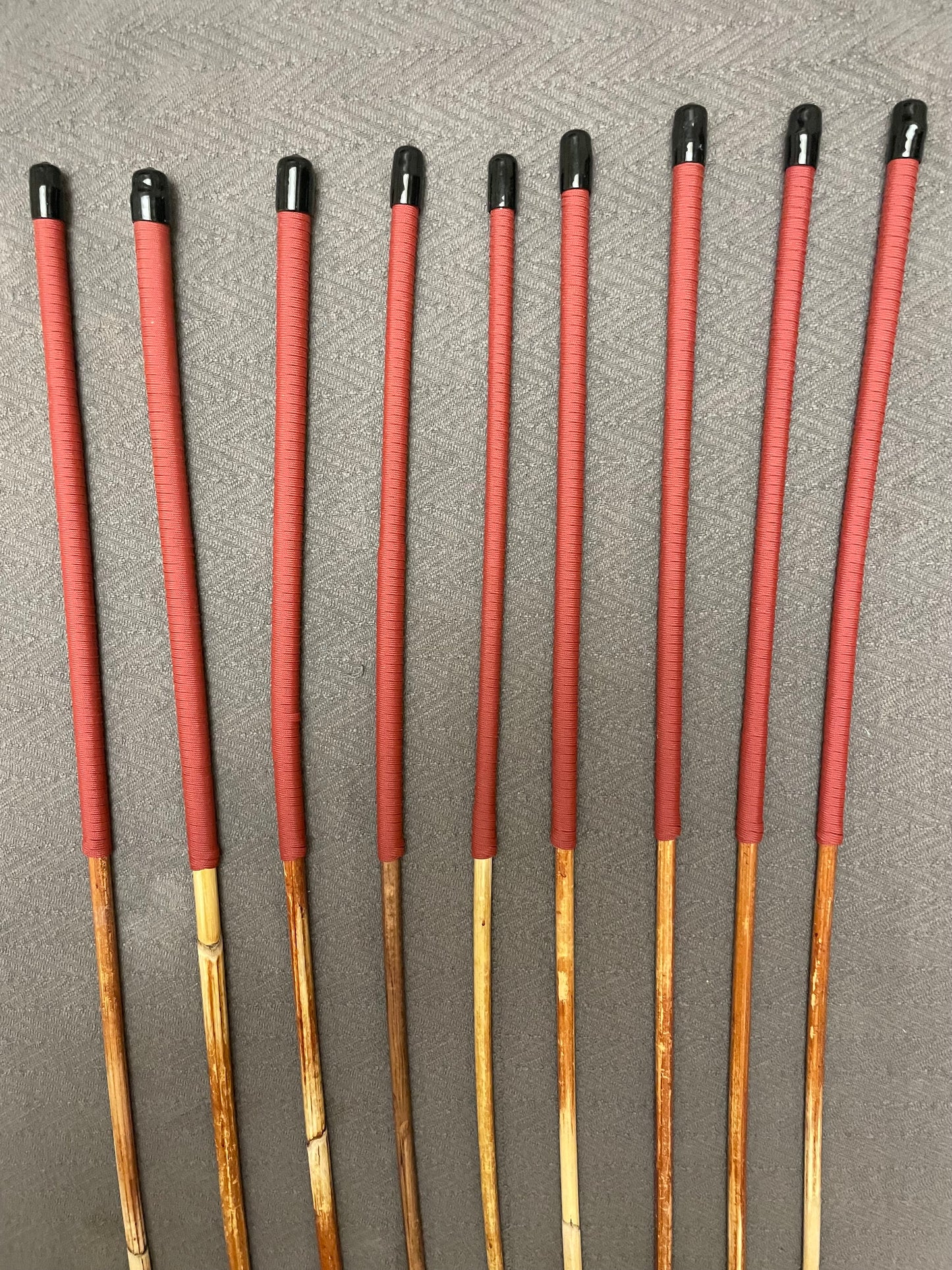 Set of 9 Classic Dragon Rattan Punishment Canes / BDSM Canes with Brick Red Paracord Handles - 95 cms Length - Englishvice Canes