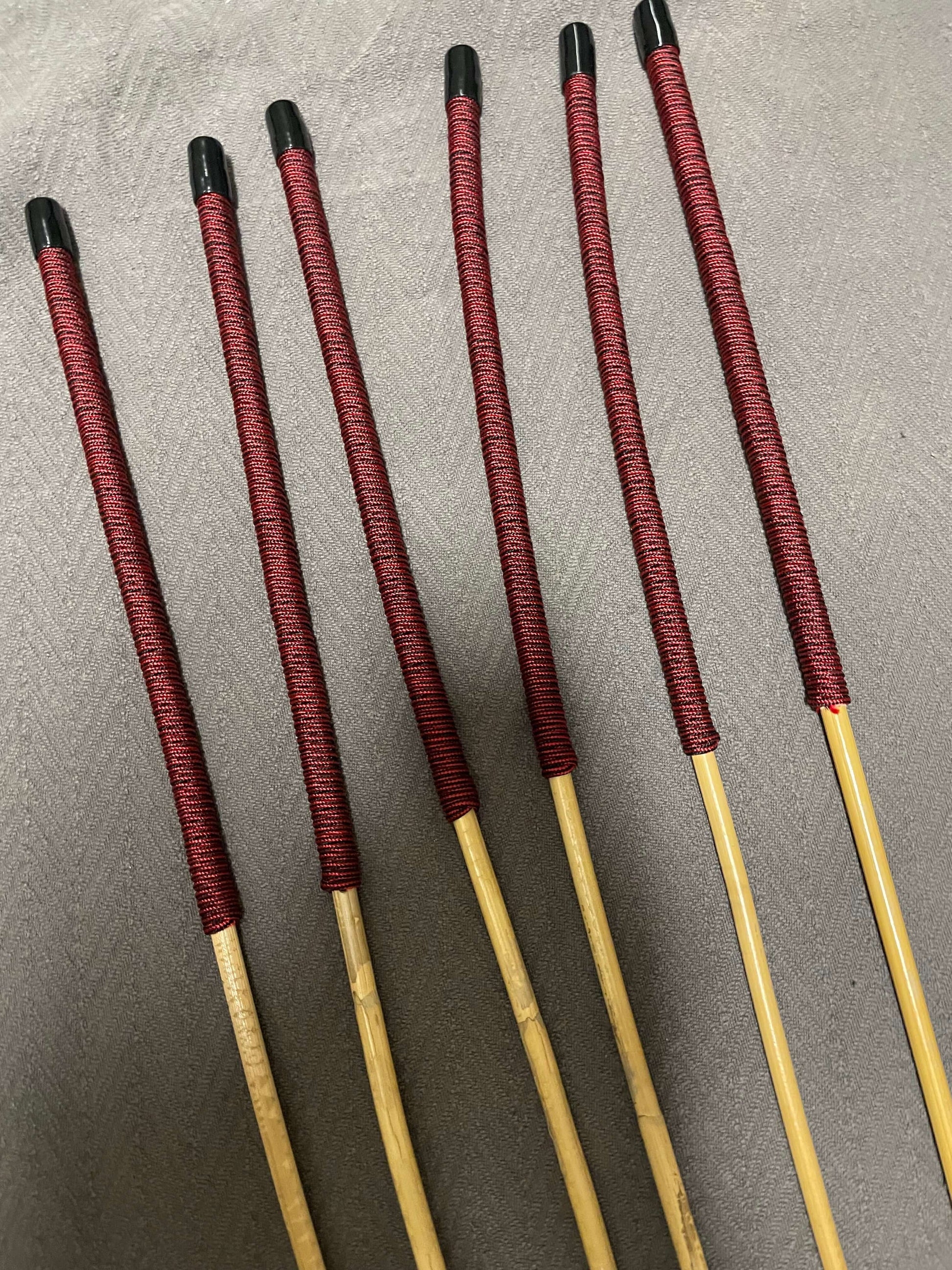 Set of 6 Classic Kooboo Rattan Punishment canes  with Liquorice Paracord Handles - 82 to 85 cms Length - 8 to 9.5 mm Diameters - Englishvice Canes