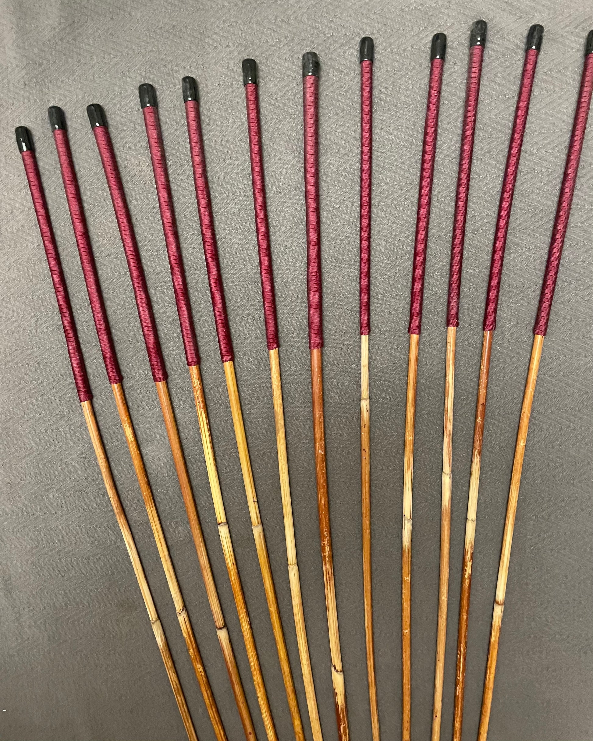 Set of 12 Classic Dragon Rattan Punishment Canes with Burgundy Paracord Handles - 95 to 100 cms Length - Sales Special