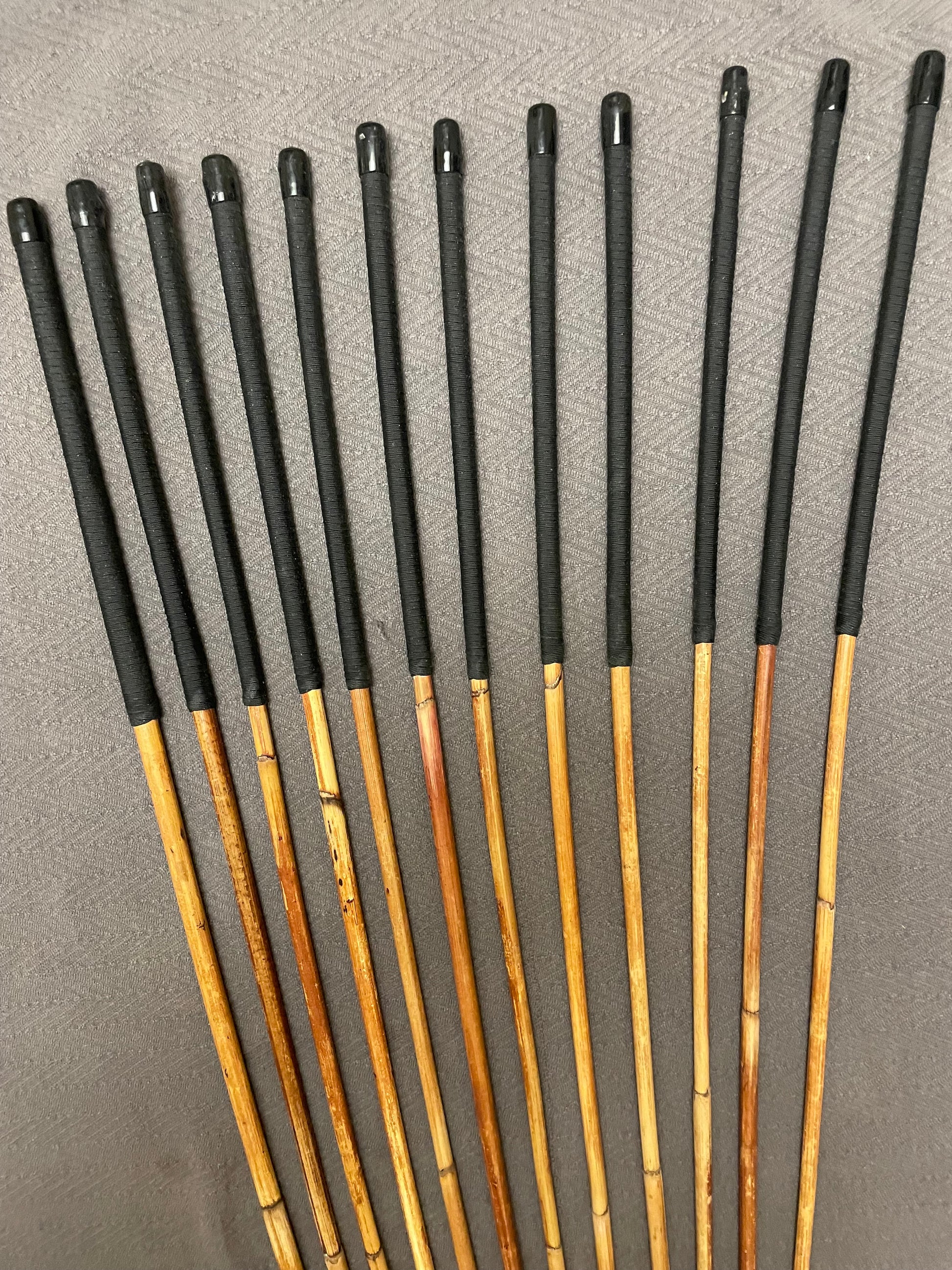 Set of 12 Classic Dragon Rattan Punishment Canes with Black Paracord Handles - 95 to 100 cms Length - Sales Special