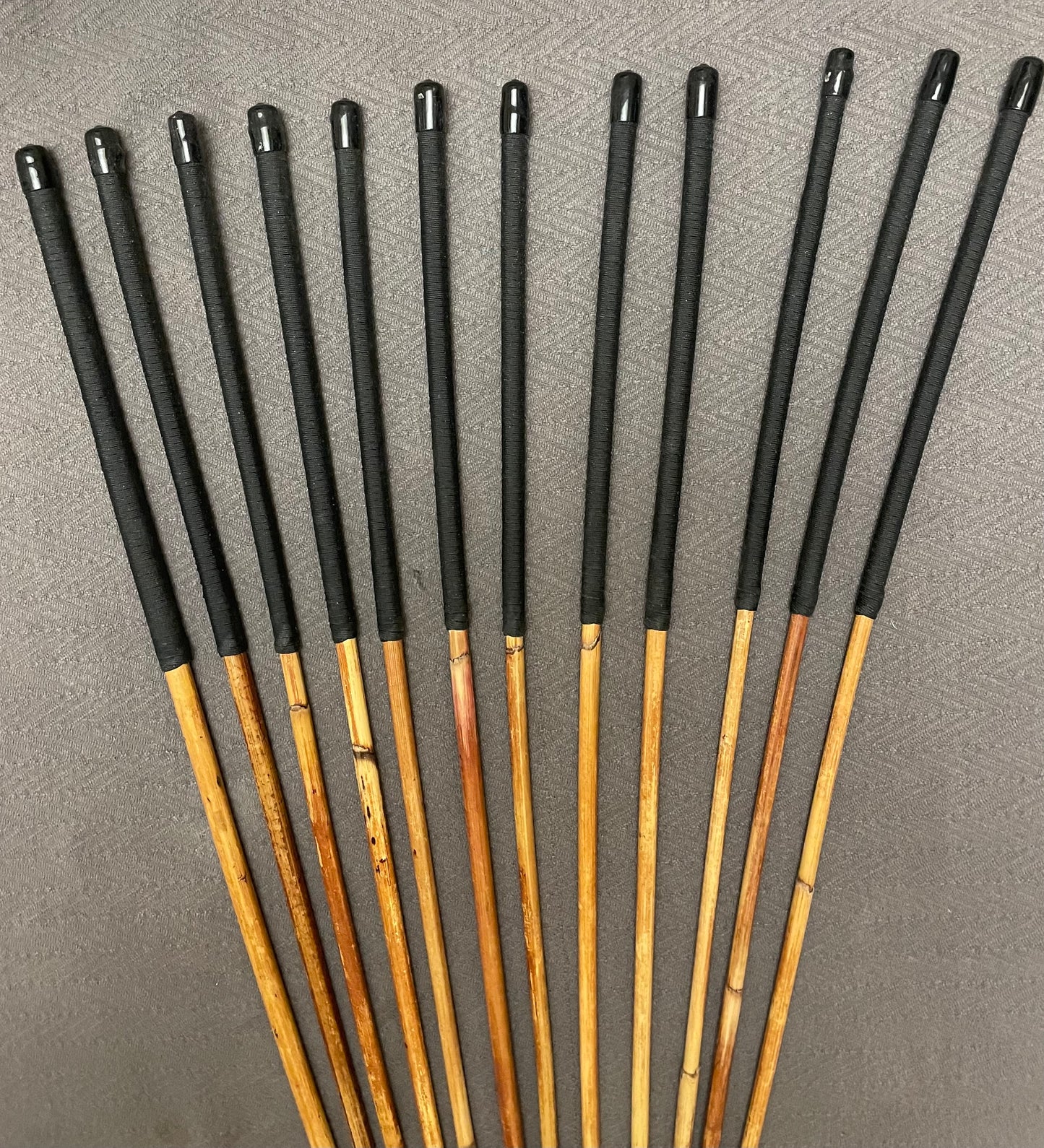 Set of 12 Classic Dragon Rattan Punishment Canes with Black Paracord Handles - 95 to 100 cms Length - Sales Special